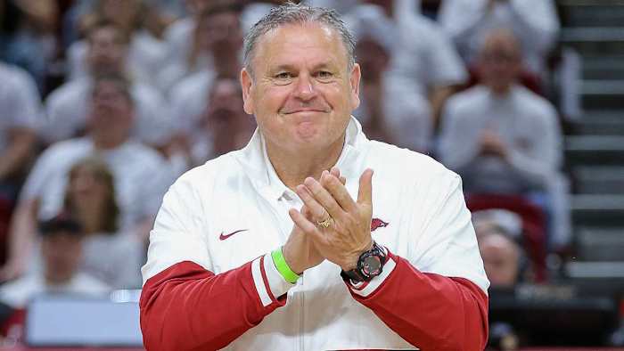 Arkansas Razorbacks football coach Sam Pittman introduced with new coaching staff at Kentucky basketball game.